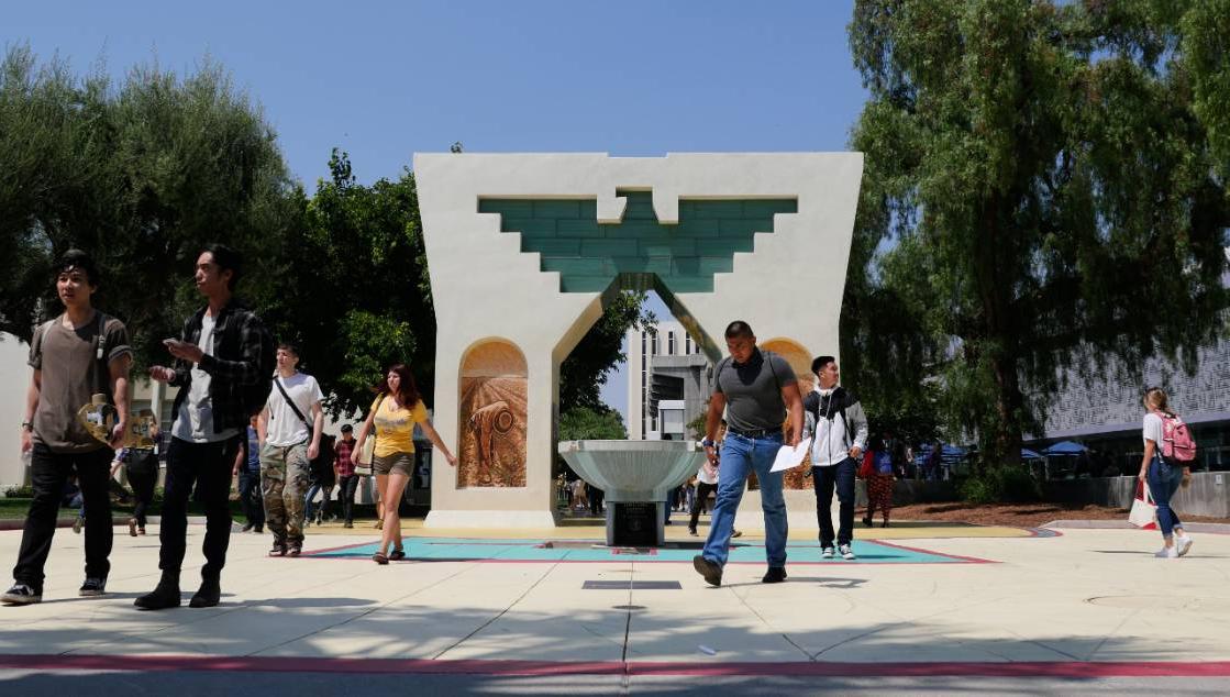 Students walking in front of Caesar Chavez Monement